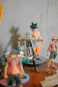Collection of anime figures including Goku, Luffy and more on display