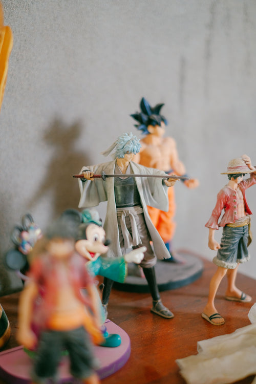 Collection of anime figures including Goku, Luffy and more on display