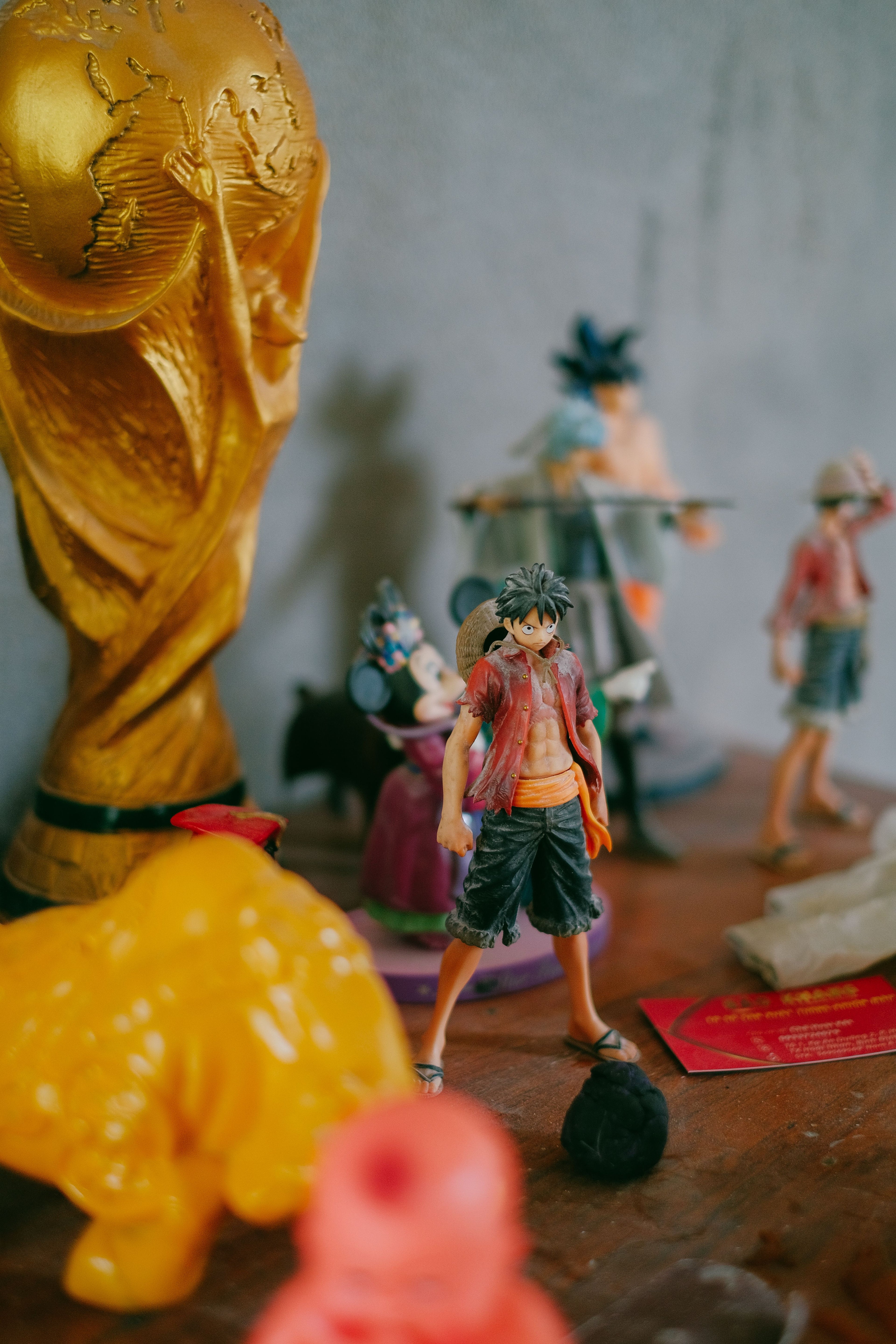 Luffy anime figure standing in display with other collectibles
